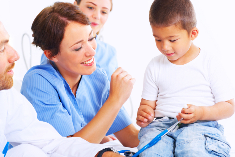 medical professionals with young boy