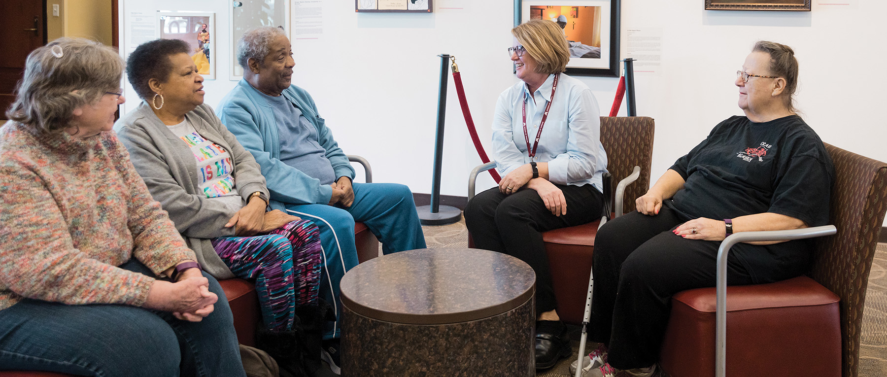 Nurse researcher Siobhan McMahon, center, discusses fall prevention with study participants in January.