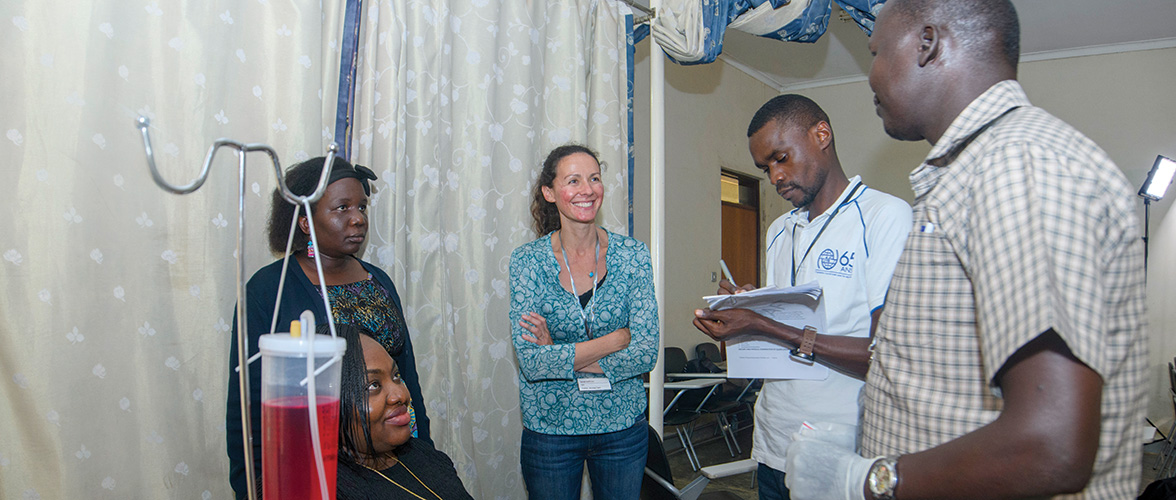 Sarah Hoffman, center, facilitated a venipuncture simulation with nurses from the IOM Africa region during a training in Kampala, Uganda last year.