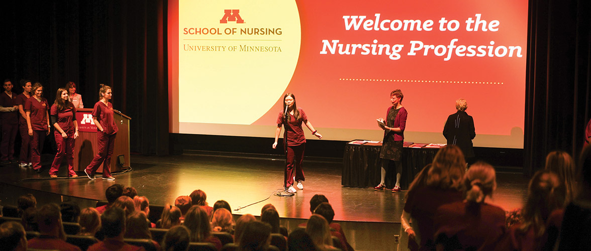 Welcome to the Nursing Profession slide with pre-licensure students on the stage