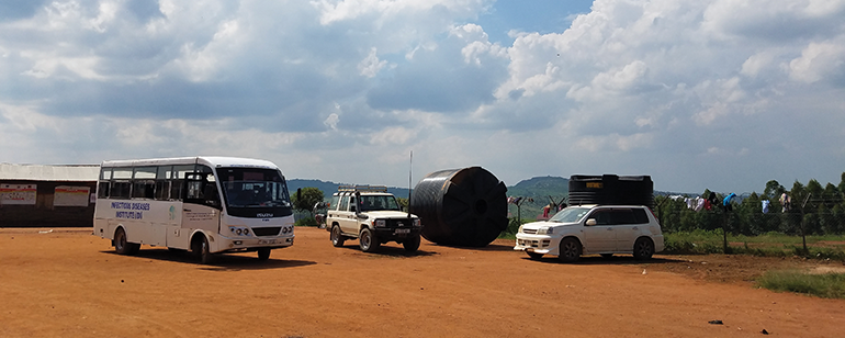 transport vehicles in a parking lot in Uganda