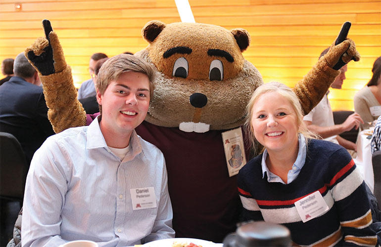 Students pose with Goldy Gopher at the Dean's Scholarship Reception