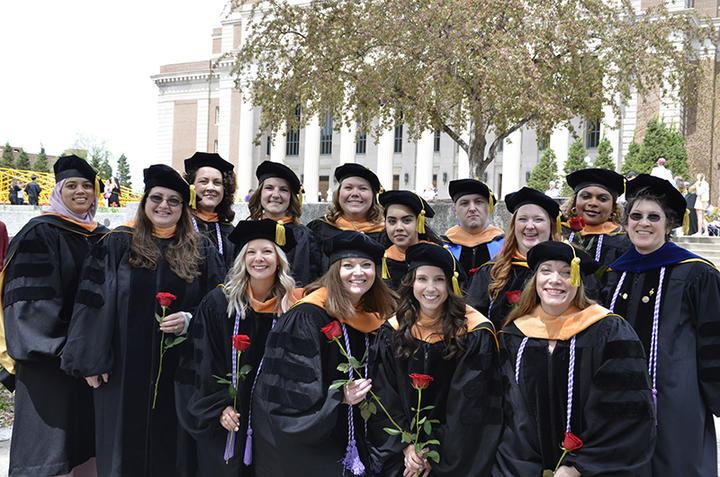 Spring 2022 group of post-baccalaureate graduates on Northrop mall 
