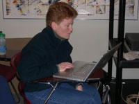 student with laptop at desk